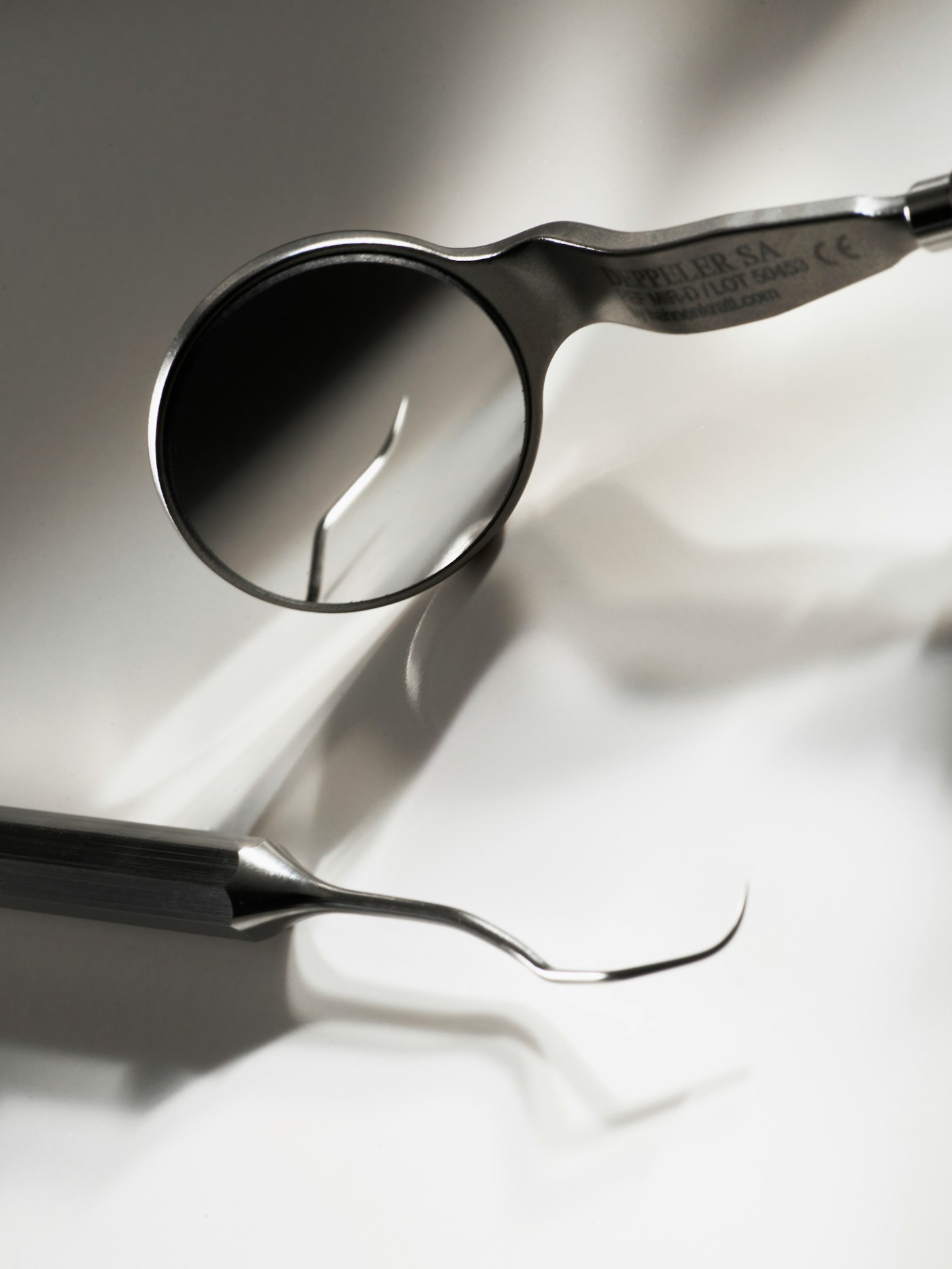 Dental mirror and explorer instruments in close-up